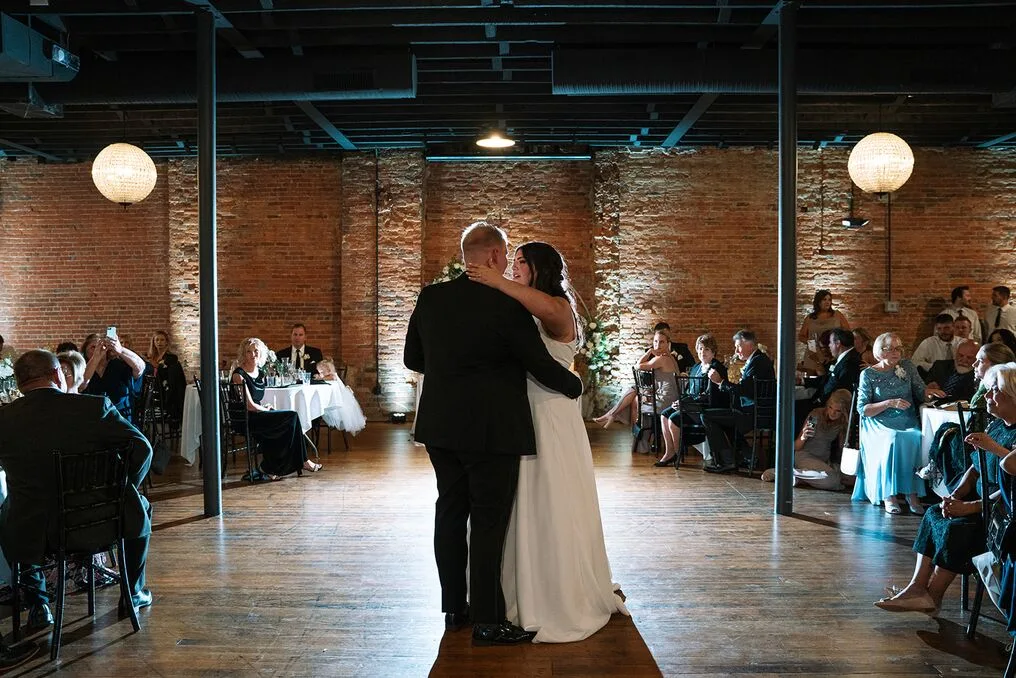 Couple in the Brickyard main room by the glass garage door
