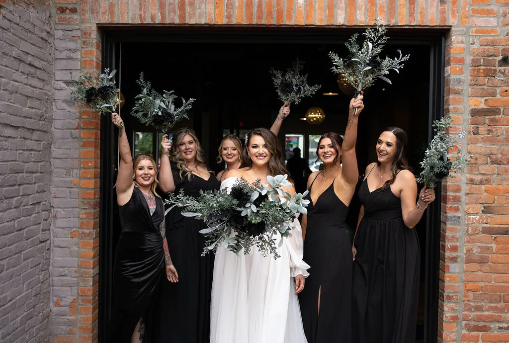 Bride and bridesmaids with bouquets at Brickyard on Main